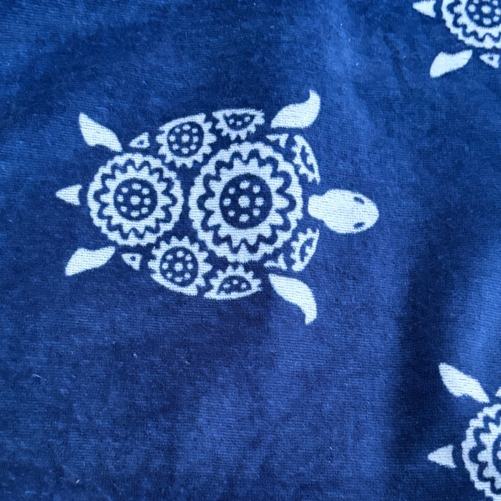 Vera Bradley navy blue turtle towel with a red trim white turtles used gently